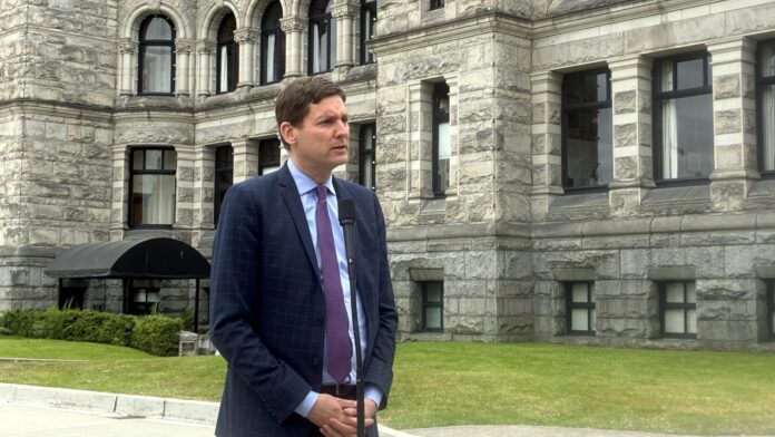 Premier David Eby speaks to reporters outside the legislature on June 17, 2025. | Emily Joveski, Vista Radio photo