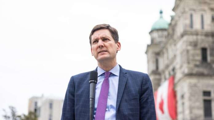Close up photo of Premier David Eby speaking outside the B.C. legislature.