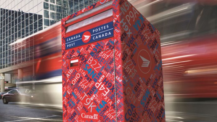 Canada Post mailbox on a city sidewalk