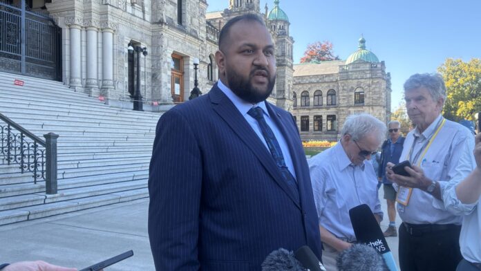 Forests Minister Ravi Parmar speaks to reporters