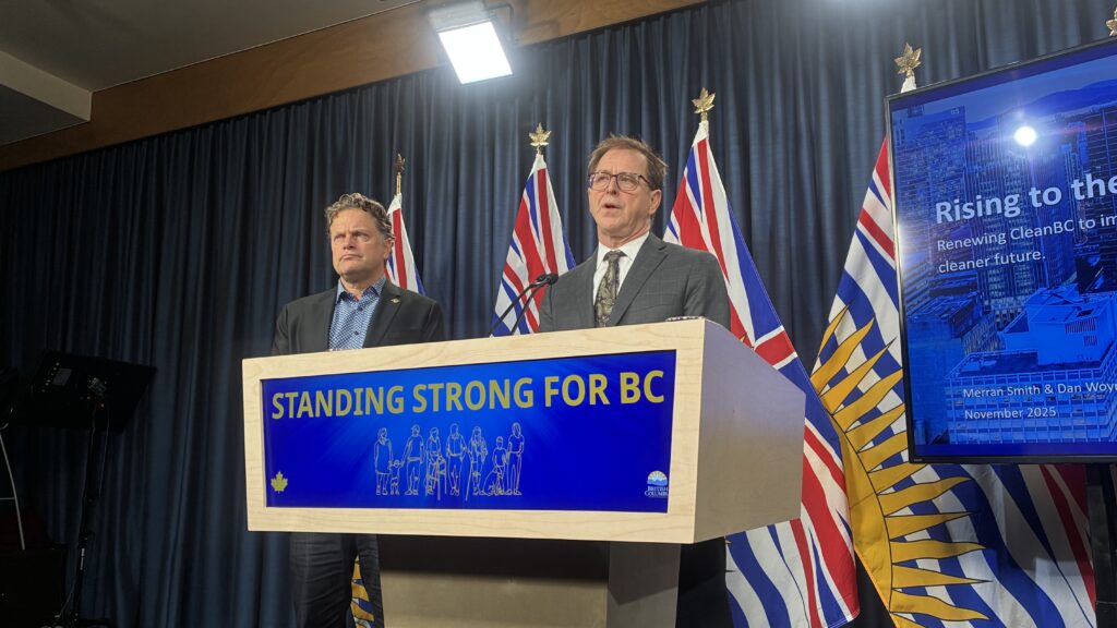 BC Energy and Climate Solutions Minister Adrian Dix speaks alongside BC Green MLA Jeremy Valeriote.