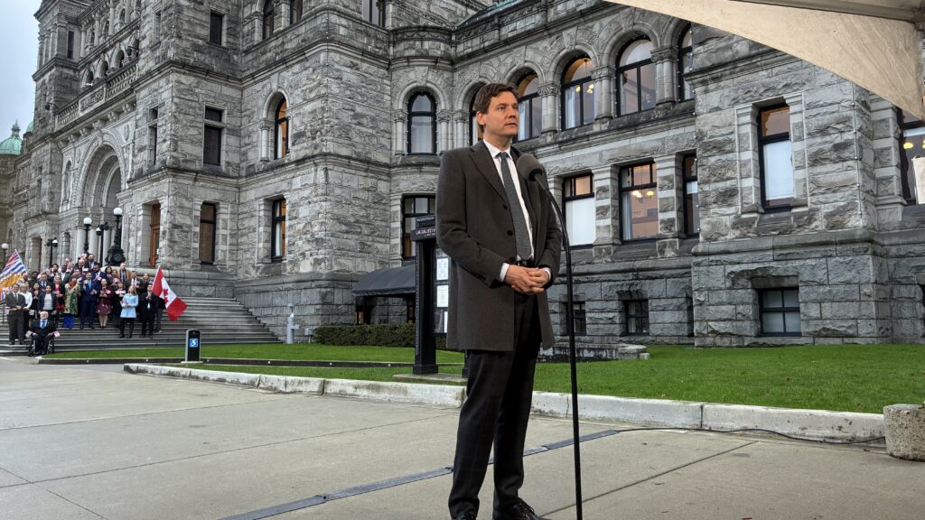 Premier David Eby speaks outside legislature