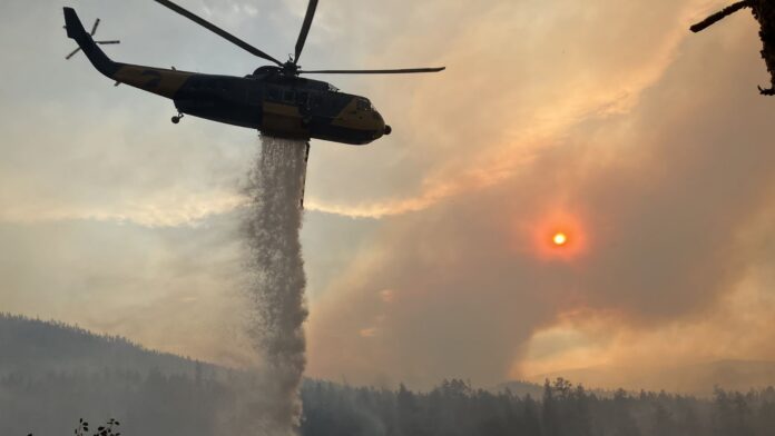 Photo by BCWS, helicopter tanking on Aug 10.